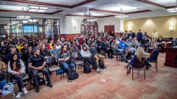 students fill a room to list to the Ambassador to Ecuador speak