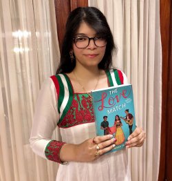 "Priyanka Taslim holding her book Love Match."
