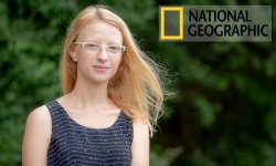 photo of professor Cornti Borgerson outside with trees in background. the National Geographic logo is in the top right of the photo