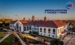 aerial photo of Cole hall at sunset. AATF (America Association of Teachers of French logo on upper right of image