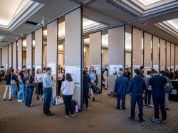 a wide shot of the University Conference Center during the Research Symposium with posters on partitions