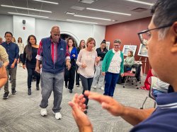 Attendees learning a dance