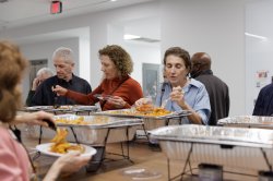 People gathered at a dinner buffet