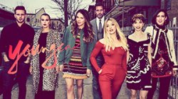 Fashionable people walking toward the camera