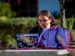 Montclair State student studying online with laptop