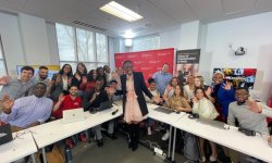 A group of students and NBC News Reporter Zinhale Essamuah posing for a group photo in the SCM Building.
