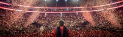 View of thousands of graduates and family members during commencement in an arena