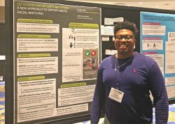 Dalvin Josias Sejour by his poster at CSCW