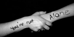 you are not alone, two hands holding on to each other