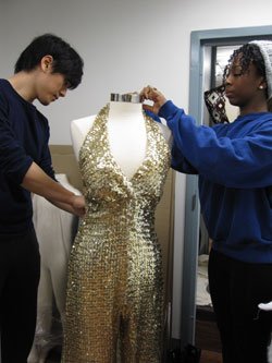 students preparing jumpsuit for display