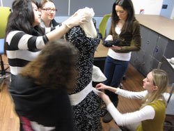 students dressing manequin