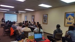 Students watch a presentation on resume building.