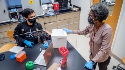 Dr. Adams teaching in the molecular biology lab