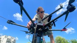 Jesse Kolodin '21 preparing a drone for launch