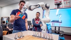 students testing robotic arm