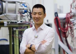 Dr. Kent Leung in front of some of his lab equipment