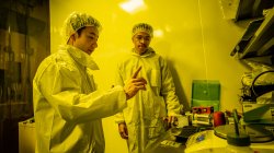 student and mentor discuss experiments in nuclear physics "clean room"