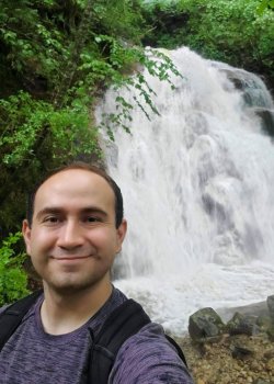 Aaron Ortiz by waterfall