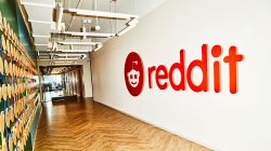 Reddit sign on office hallway wall