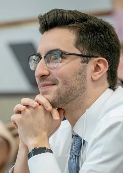 Matteo watching his classmates present in the Spring 2025 Science Slam