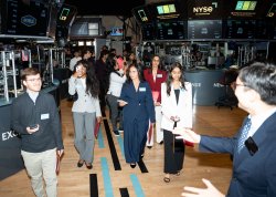 Paola Benavides Pena with other students touring the NYSE