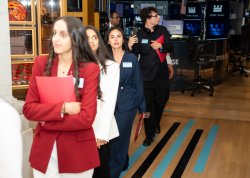 Paola Benavides Pena with other students touring the NYSE