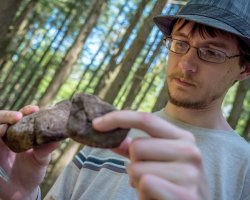 student comparing rocks