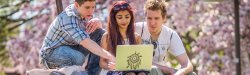 Photo of students in spring with laptop