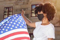Masked Woman holding American Flag