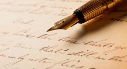 fountain pen rests on top of paper with words written in cursive