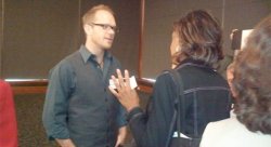 Keynote speaker Zak Cassady-Dorion, partner at Crowdfund Capital Advisors, chats with attendees after the event.