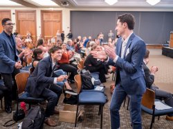 Students on the winning team, Wheatpaste, celebrate as their name is called at the 2018 BulbHead pitch contest.