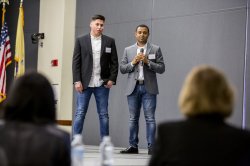 Two students at pitch competition