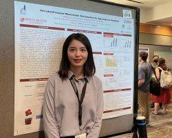 Qiufeng Lin with poster at NJWEA conference