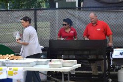 Ana Pinto, Preya Sanasie, and Steve Ruggiero prep for the cookout