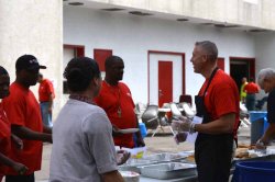 Employees line up to be served by AVP Connolly and Director Pinto