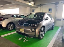 Photo of cars using the electric vehicle charging stations in the Red Hawk Parking Deck