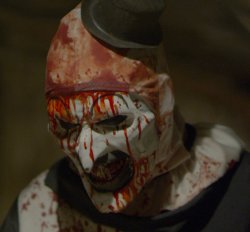 Screen capture showing mutilated clown character from: Terrified, a film in the horror genre