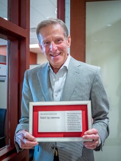 lieberman holding his plaque