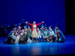 students performing on stage