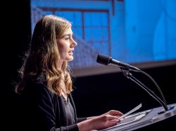 female speaker at lectern