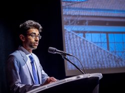 male speaker at lectern
