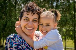Mother and daughter outside on sunny day