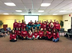 Group of Peer Advocates inside in red and teal shirts
