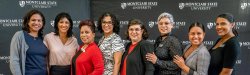 8 women smiling at Latina Equal Pay Day Event