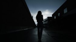 BW photo of a girl in an alley