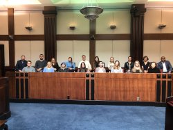 students posing for photo in Jury box US District Court of Newark NJ with Hon. Jude Patty Shwartz