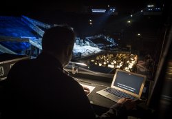 Image from a control room of someone titling a live performance.