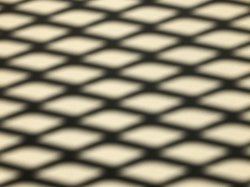 shadow of chain-link fence