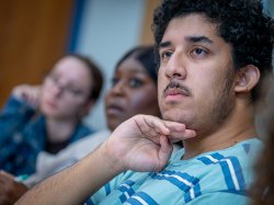 male student in writing class